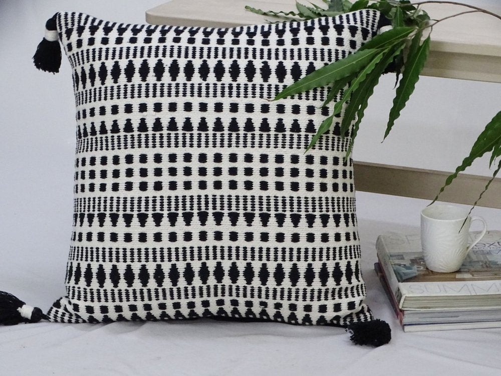22" Black and White Southwestern Cotton Blend Throw Pillow With Tassels